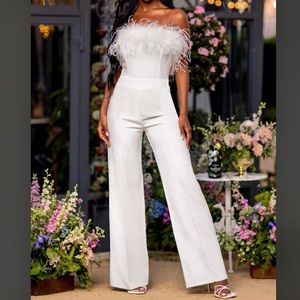 White jumpsuit with feathers